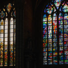 Colorful stained glass windows of the St Bavo's Cathedral in Ghent